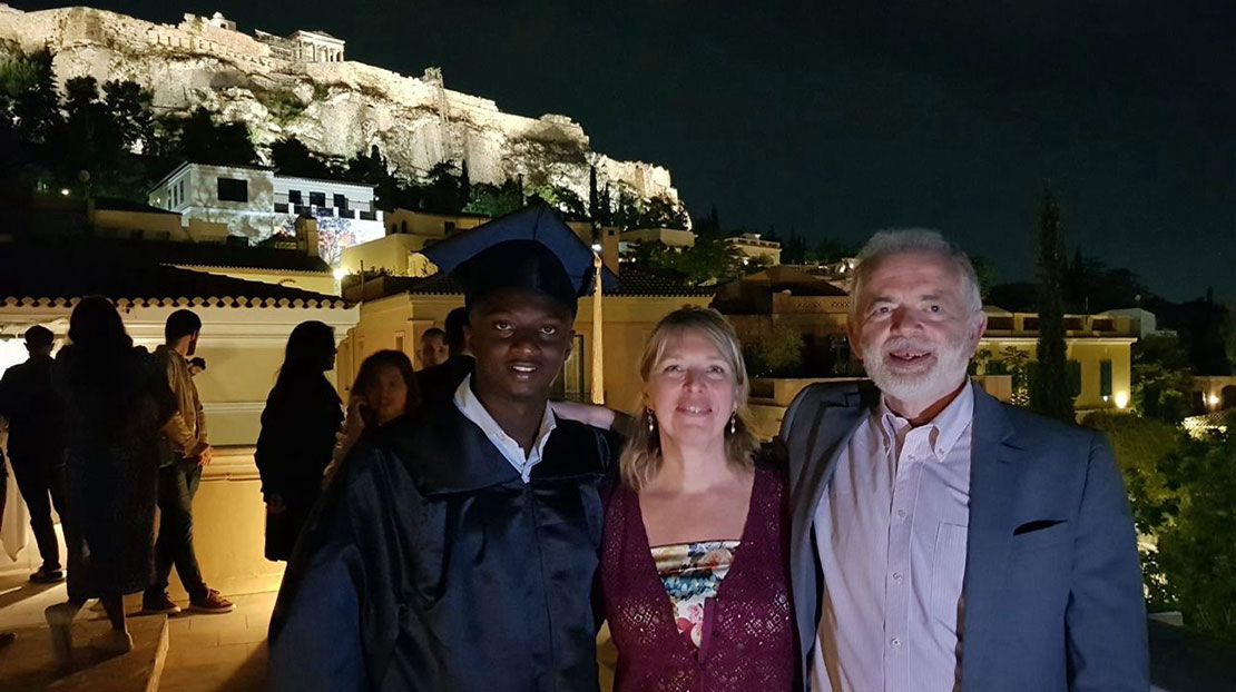 Webster University in Athens, Commencement 2024. Student with supporters in front of the Acropolis in Athens. 