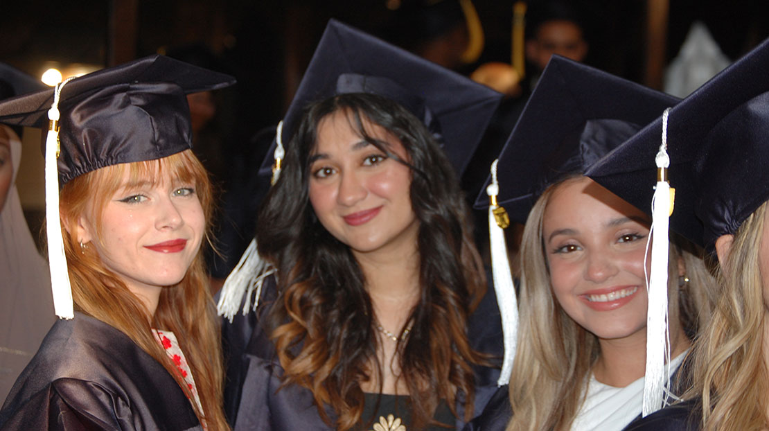 Students in caps and gowns at Webster University in Athens, Commencement 2024.