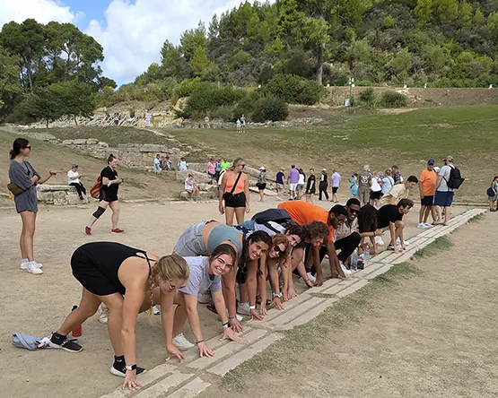 Students prepare to run in the ancient Olympia stadium.