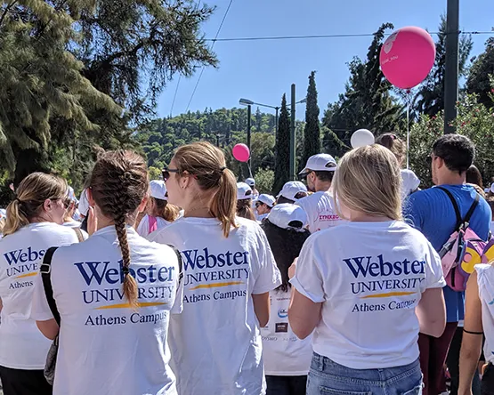 students walk in Athens street for the race of the cure initiative