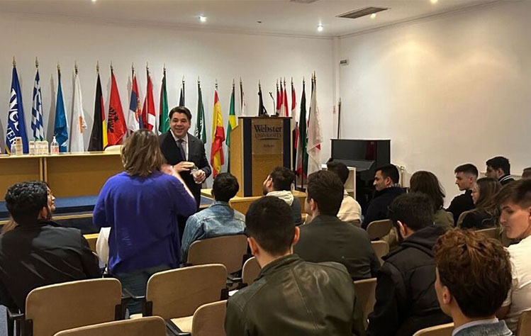 Tsunis speaks with Webster University Athens international relations students as part of the forum’s opening address.